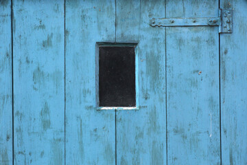 A close-up of a bright blue door