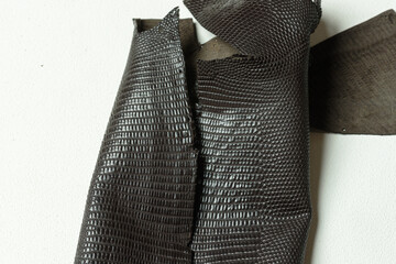 Lizard leather tanned in Thailand.
