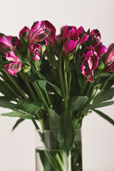 Alstroemeria flowers bouquet in a vase. Fresh flowers for home decor