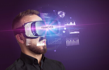 Businessman looking through Virtual Reality glasses