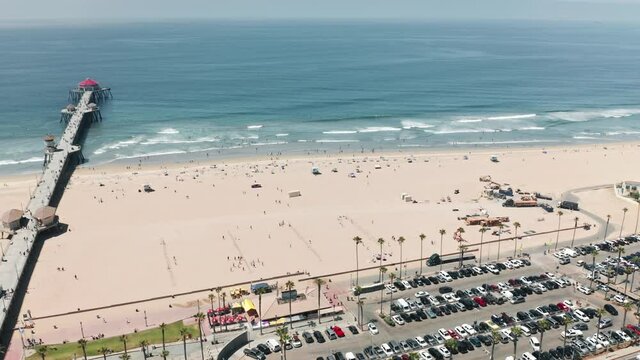 Perfect summer background with copy and text space on blue ocean and white sandy beach. Ideal californication 4K. Cinematic view on scenic pier in Manhattan Beach, California USA on sunny summer day