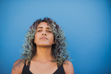 Portrait of woman with curly hair shot up close