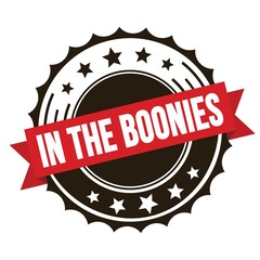 Obraz premium IN THE BOONIES text on red brown ribbon stamp.