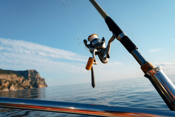 Fishing rod on a sailboat in open sea, close up