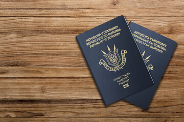 Burundi  passport on wooden background  .The 
Burundi passport is issued to citizens of Burundi  for international travel.