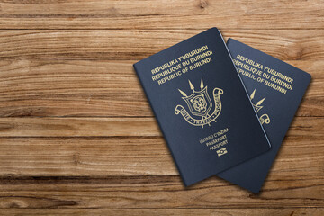 Burundi  passport on wooden background  .The 
Burundi passport is issued to citizens of Burundi  for international travel.