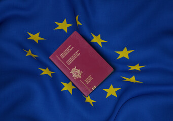 Belgium passport with European Union flag in background 