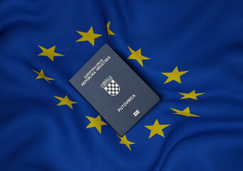 Croatia passport with European Union flag in background 