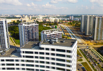 Fototapeta premium Top view of the new beautiful architectural building of the business center in the city center. 25 September 2021, Minsk, Belarus
