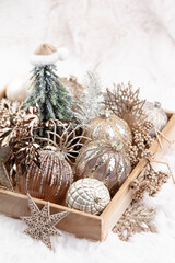 Golden christmas balls with wool background.