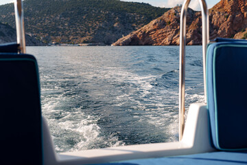 Fototapeta na wymiar Motor yacht cruising in the sea, view from the stern