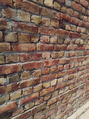 Red bricked wall background. Textured wall background.
