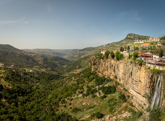 Panorama of Jezzine town and landscape with famous 90 meter high waterfall pouring into a dry valley, in Southern Lebanon, Middle East - obrazy, fototapety, plakaty
