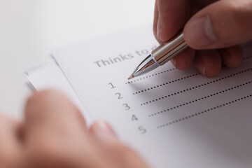 Close-up of businessman hand planning Thinks To Do List