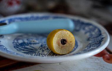 cut forest quince lies on a plate. out of focus.