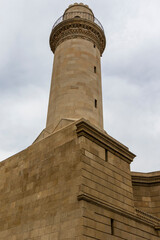 Facade of the Beyler mosque and minaret in the old city of Baku, Azerbeijan (Unesco World Heritage...