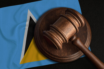 Judge Gavel and flag of Saint Lucia. Law and justice in 222. Violation of rights and freedoms