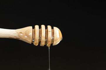 honey dripping from a spoon