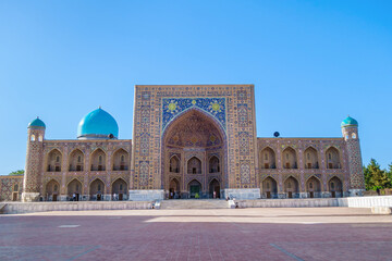 Facade of Tilya Kori Madrasah, one of the most famous and oldest buildings in Samarkand, Uzbekistan. Building is decorated with traditional Eastern ornaments and patterns