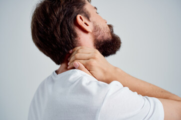 man holding neck arthritis health problems studio treatment