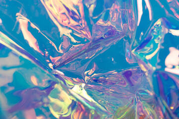 Blue defocused holographic backdrop. Wrinkled foil material. Fluid futuristic texture.