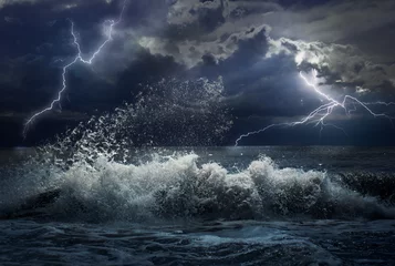 Fotobehang Storm in oceaan met verlichting © Andrey Kuzmin