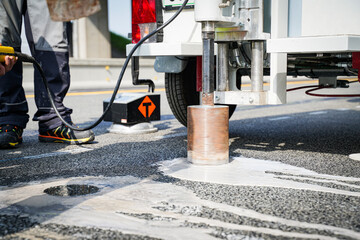 Core cutter machine cutting the asphalt with drill.