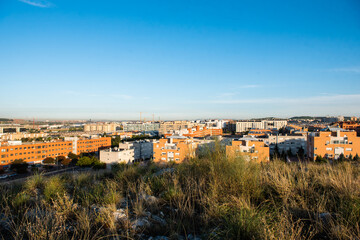 Fototapeta na wymiar cityscape of buildings and houses at sunrise in Rivas Vaciamadrid and Rivas Futura in Madrid, Spain