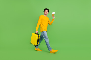 Full length body size photo man with luggage showing plane tickets isolated pastel pink color background