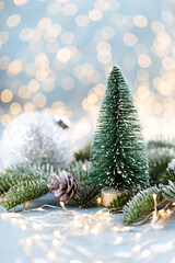 Christmas spruce with tree and blurred shiny lights.