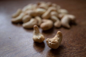 Tasty cashew nuts as background, top view