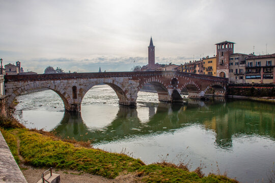 Ponte Pietra: Picturesque Roman arch bridge, built in 100 BC. NS. and rebuilt after World War II.  Verona city -  winter  vacations.