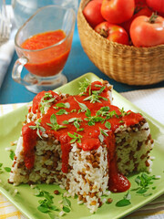 Rice with lentils and tomato sauce.