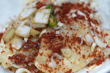 Flat dumplings with sauce