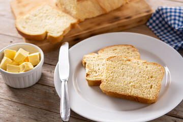 Braided egg bread on wooden table	