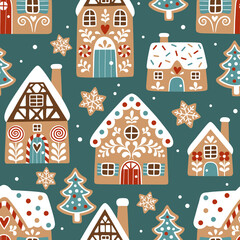 Seamless vector pattern with cute gingerbread houses and cookies on dark green background. Perfect for textile, wallpaper or print design.