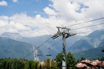 cable car with open trailers in the mountains. 