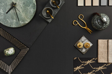 Flat lay composition of creative black architect moodboard with samples of building, textile and natural materials and personal accessories. Top view, black backgroung, template.