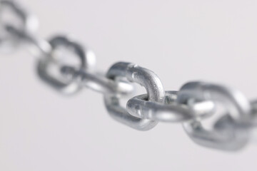Fototapeta premium Chromed metal chain links in air closeup