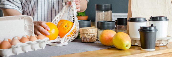 Food delivery home.Contactless delivery service.Online order and payment.Store services in food delivery in quarantine covid.Girl in the kitchen arranges food Zero waste