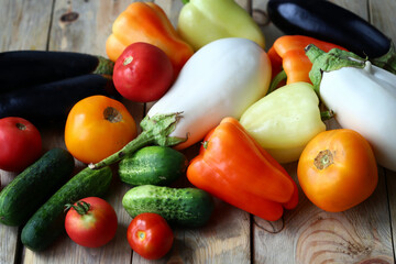 Set of farm vegetables on a wooden surface. Healthy food. Eco products.