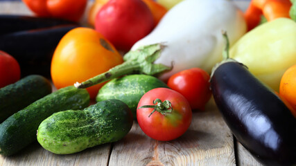 Set of farm vegetables on a wooden surface. Healthy food. Eco products.