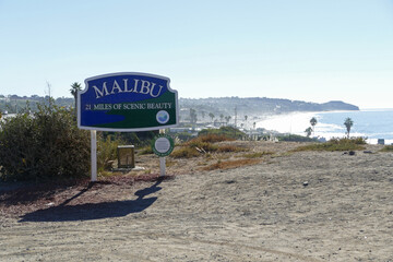 Malibu Beach road sign, famous luxury sea shore with rich people and stars houses, California, United States