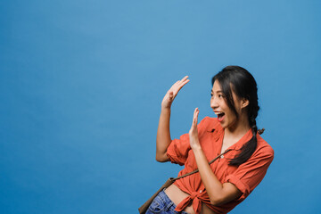 Young Asia lady feel happiness with positive expression, joyful surprise funky, dressed in casual...