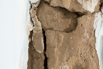 Close-up of an old cracked wall. Crack on the old wall.