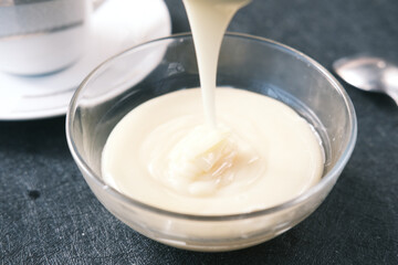condensed milk in a bowl close up,