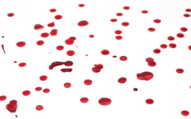 Drops of blood staining spots on a white background, medecine, drug addiction, killing