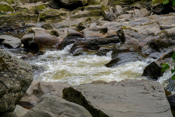 Water flowing over rocks in a river