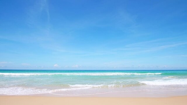 Phuket beach Thailand. Beautiful tropical beach with blue sky and clouds. Tropical beach with waves crashing empty beach. Andaman  Sea sand and sky on beautiful summer day holiday