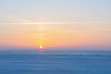 Obraz premium Beautiful winter landscape with a sunset in the north